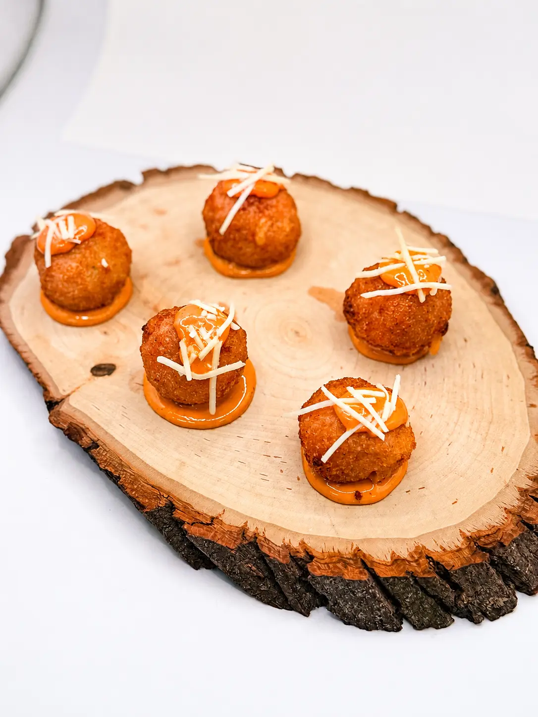 Crispy mac and cheese bites with roasted pepper aioli