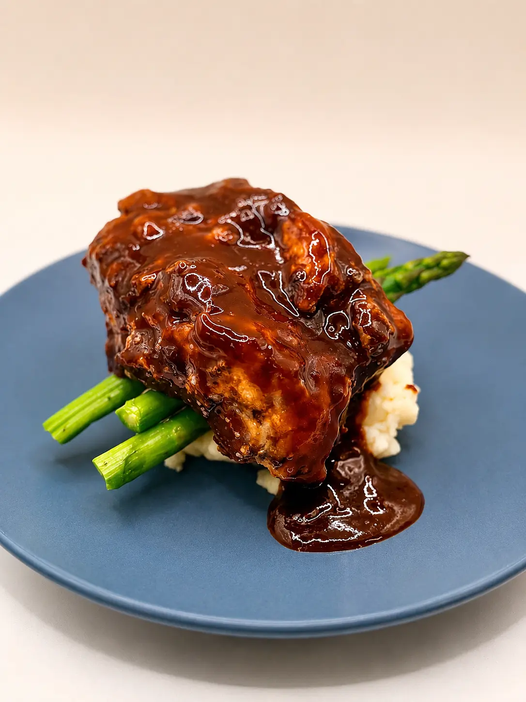 Braised short rib over whipped potatoes with asparagus